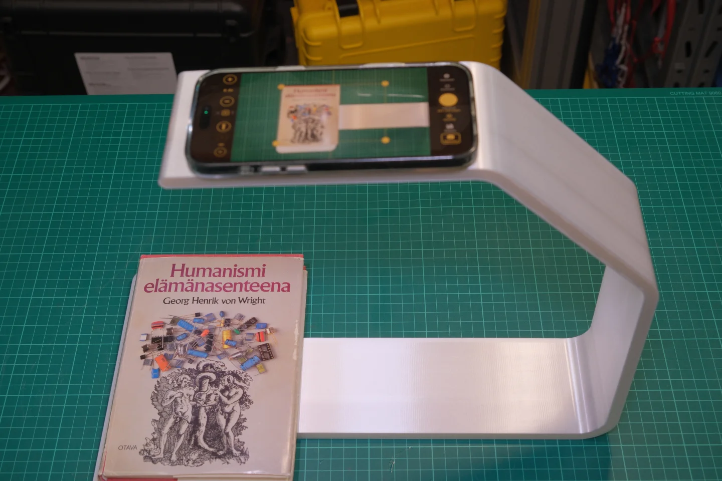 Knut 3D-printed book scanning stand assembled with iPhone 15–17 Pro Max